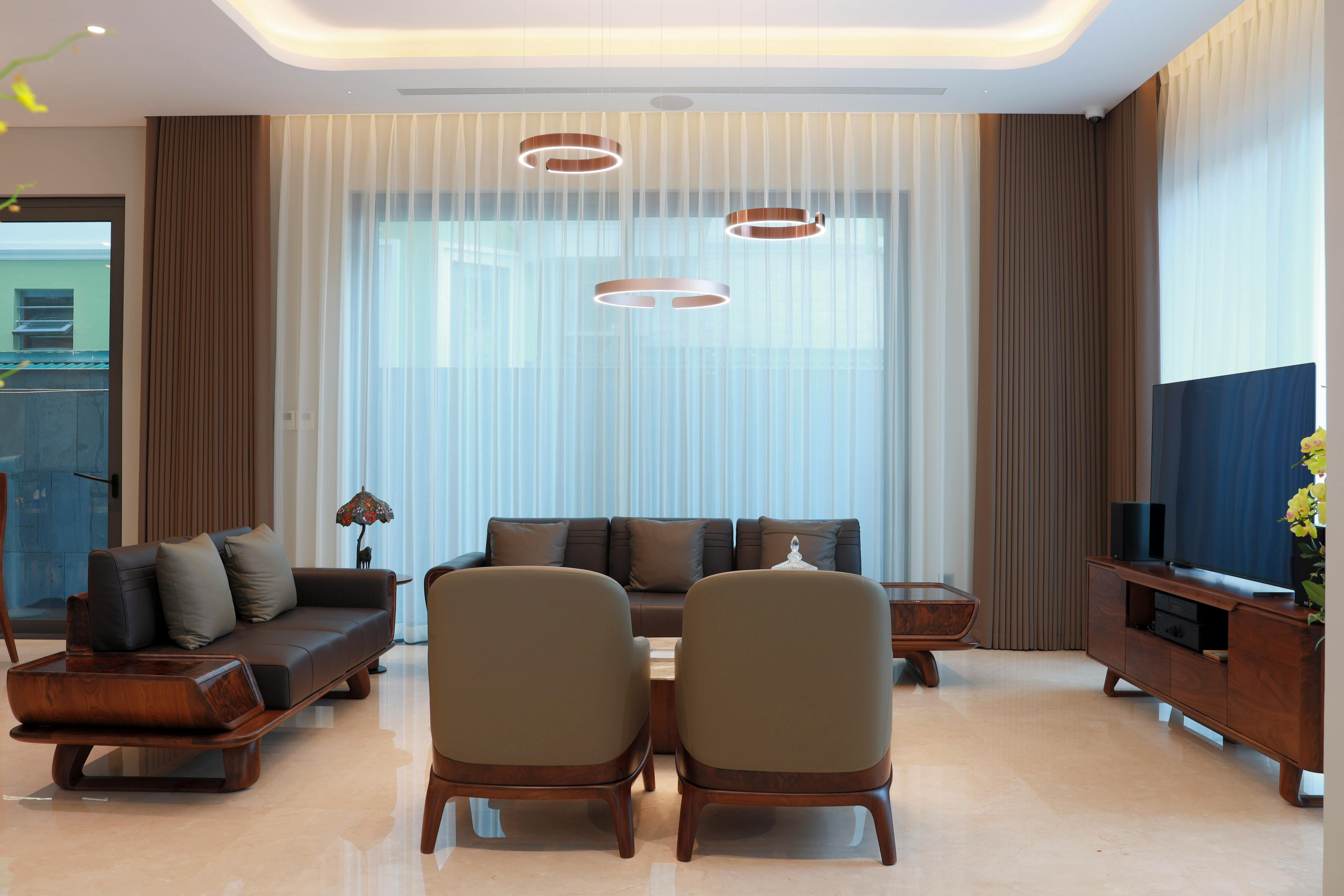 Service Elegant modern living room with minimalist furniture and soft lighting.
